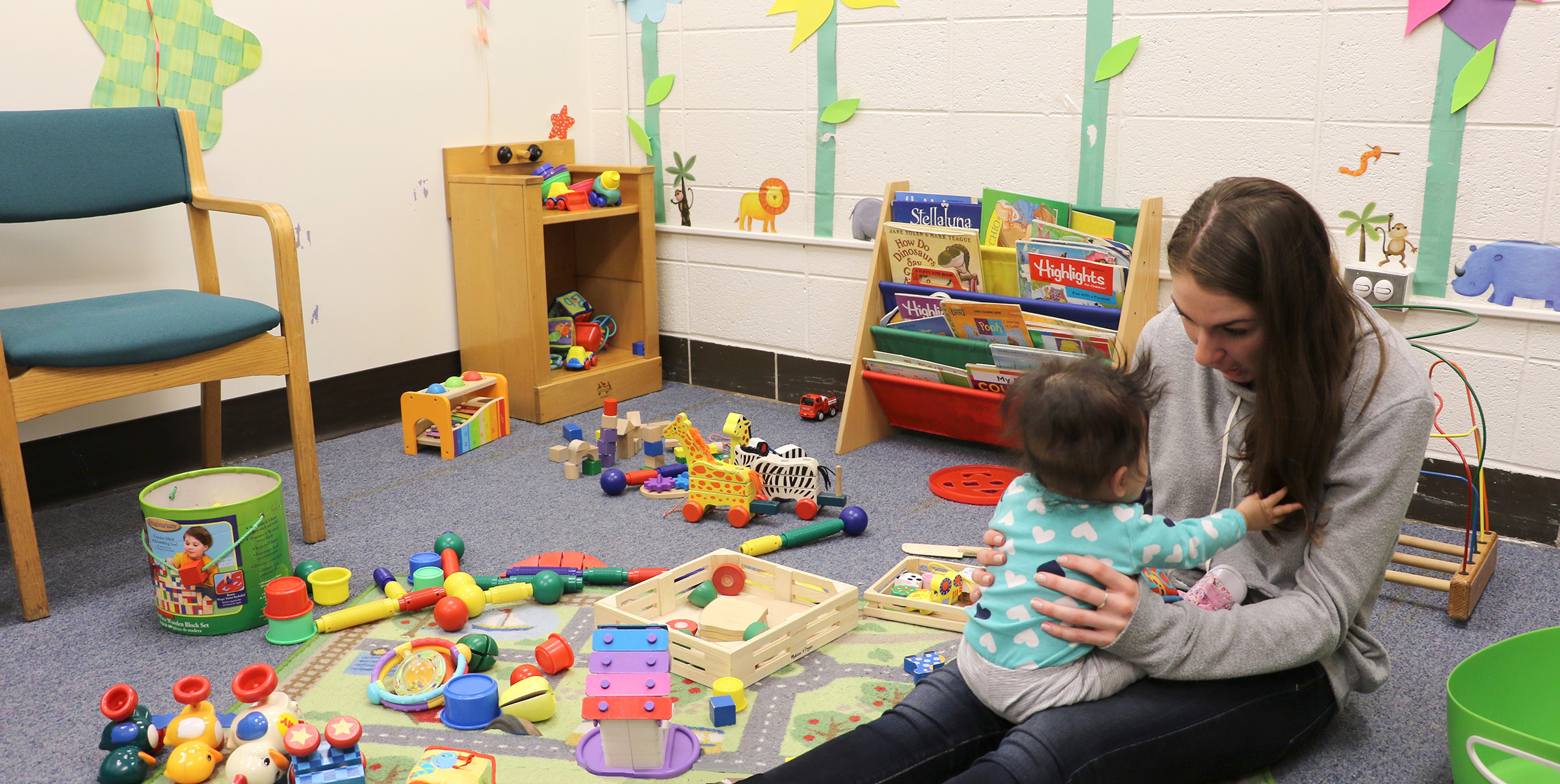 Student with baby in Child's Play Lab