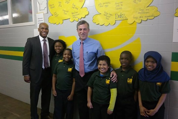 Lamont Browne (left) with U.S. Rep. John Carney and students at EastSide Charter.