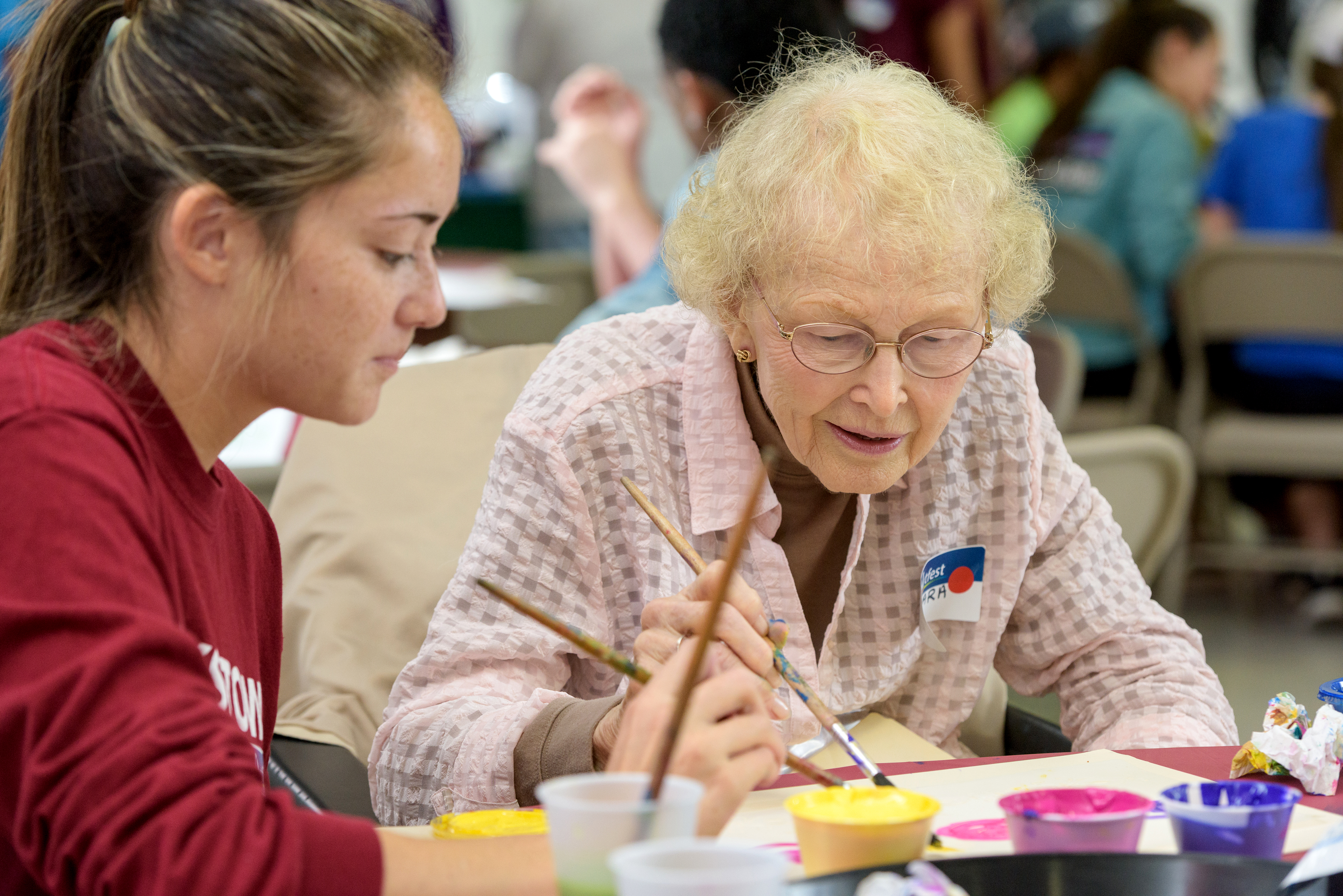 Student helps woman during artiest