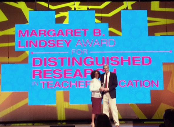 UD Professor accepts and award