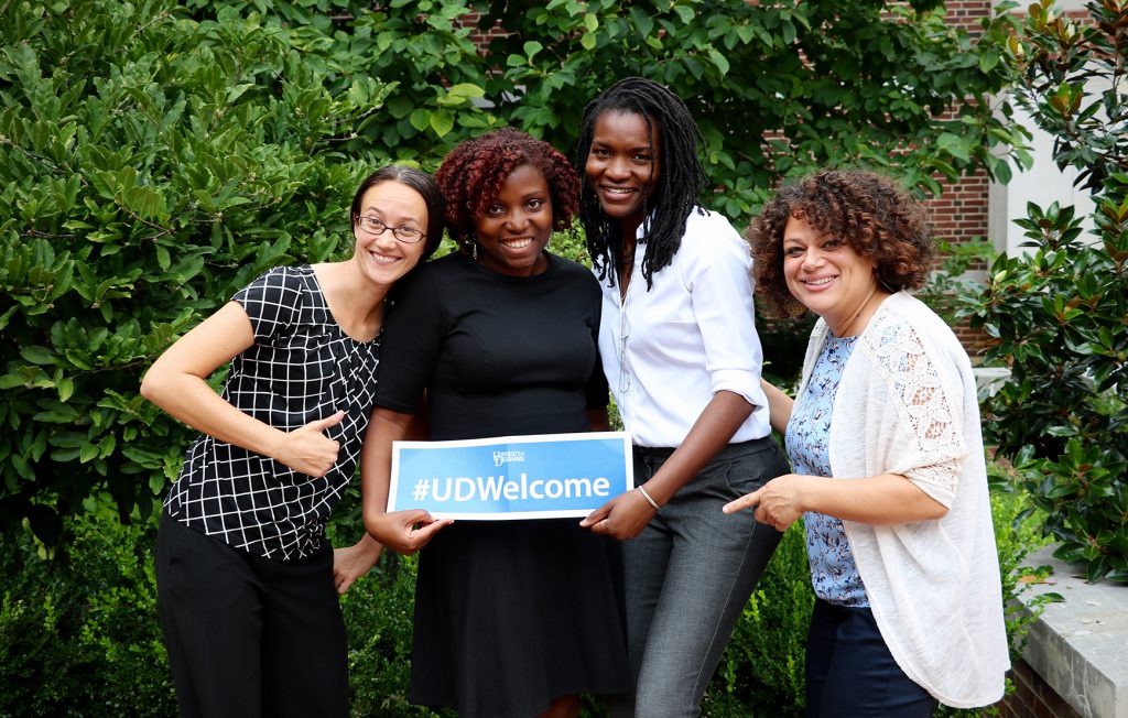 CEHD faculty holding welcome sign