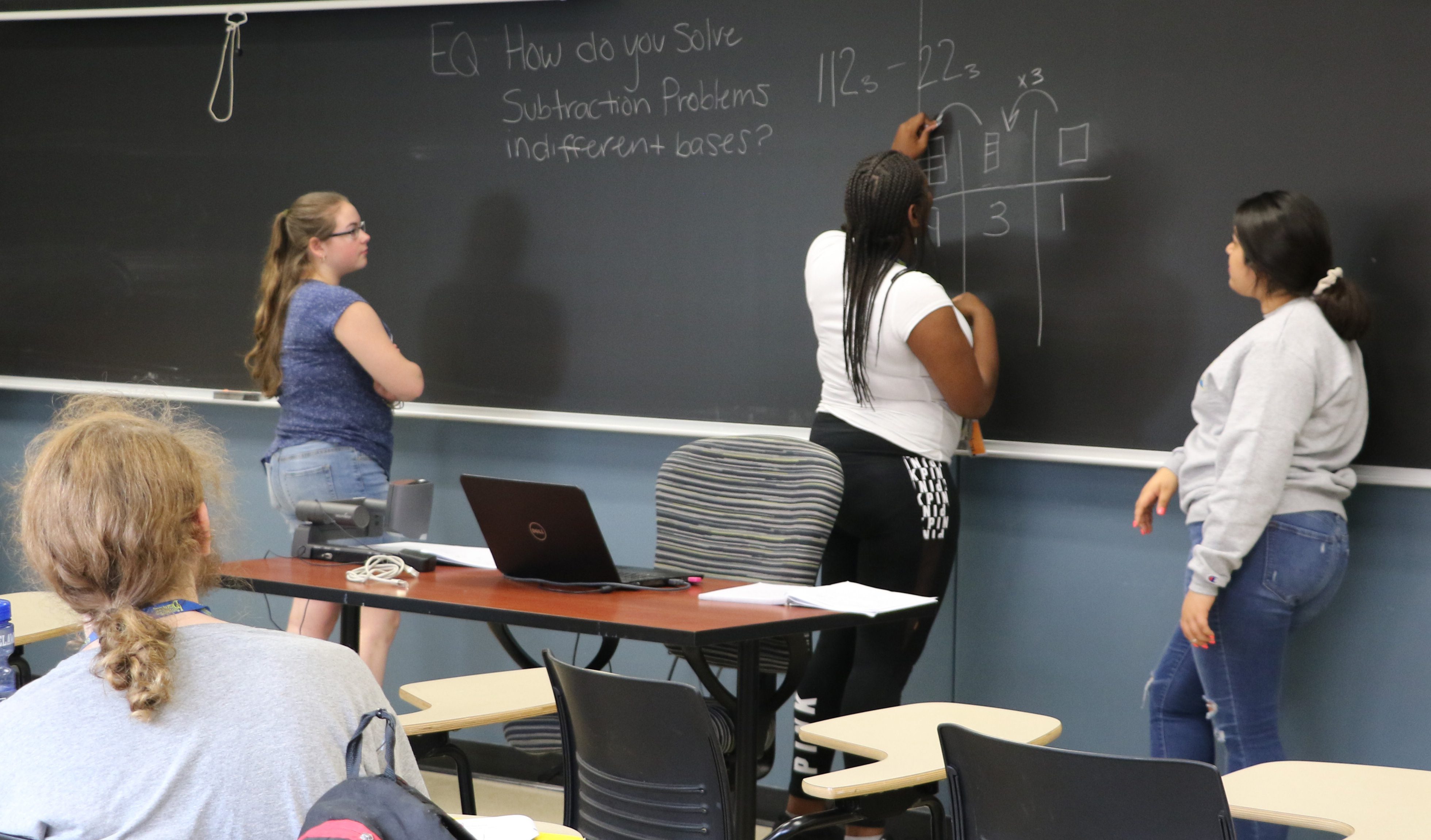 Students discuss math problem