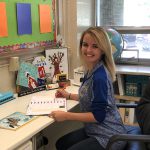 Emily Halliday sits in her classroom