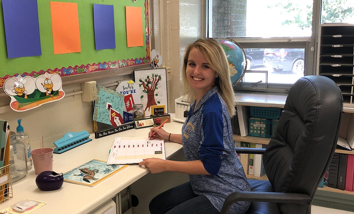 Emily Halliday sits in her classroom