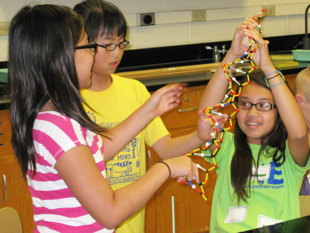 Three students with DNA model