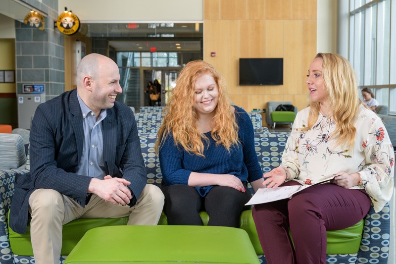 oshua Wilson, assistant professor in the University of Delaware’s School of Education, with undergraduate research assistants Mckenna Winnie and Ally Raiche.