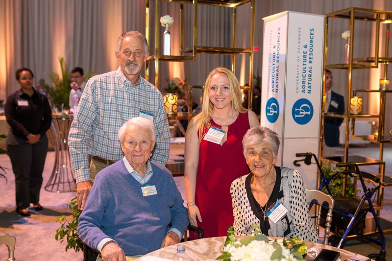 UD student and scholarship recipient Ally Raiche (standing, second from right), Class of 2021, met the Wolf family during the Celebration of Scholarship.