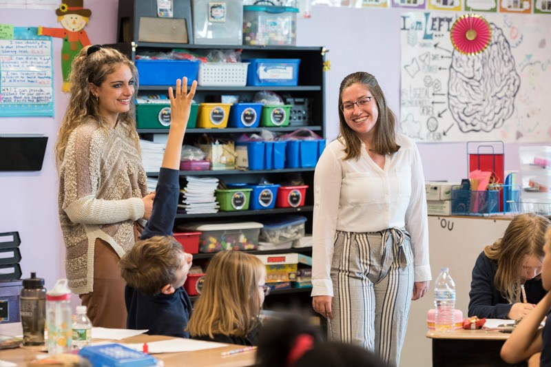 UD elementary teacher education majors Ashley Sullivan (left) and Briana Nolin student-teaching at Providence Creek Academy.