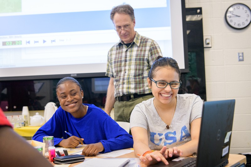 UD Associate Professor Charles Hohensee (center) oversees a summer math workshop for local high school students as part of a $750,000 National Science Foundation grant to study backward transfer