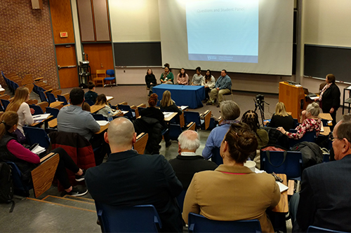 Students speak on a panel at a graduate open house at Willard Hall