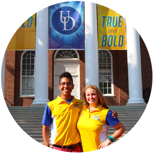 Two new student orientation leaders standing in front of Memorial Hall