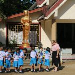 Allison Scott stands with her fourth grade students outside the Surat Thani International School in Thailand.