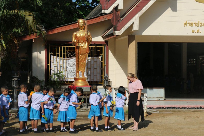 Allison Scott stands with her fourth grade students outside the Surat Thani International School in Thailand.