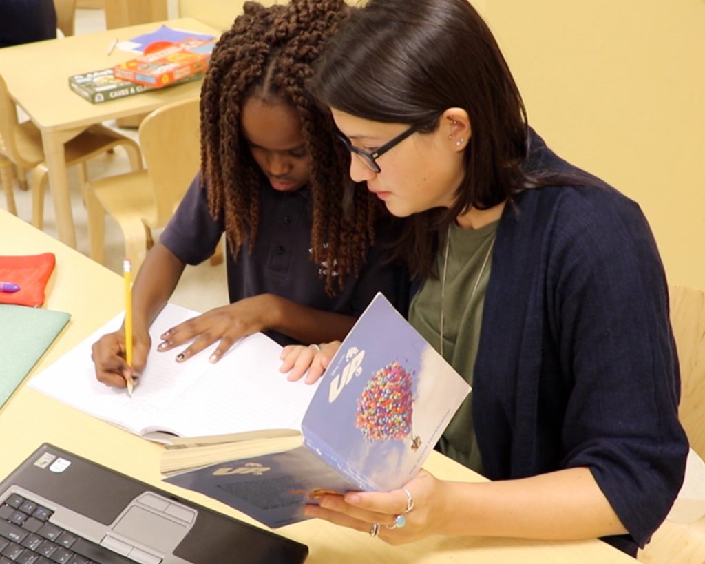 Teacher working with student