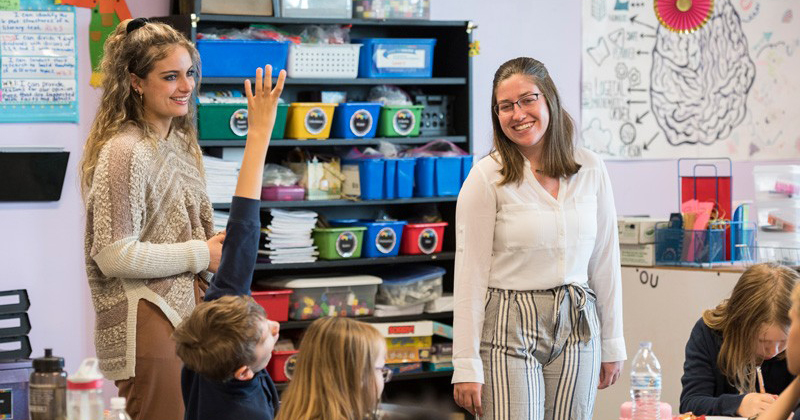 UD elementary teacher education majors Ashley Sullivan (left) and Briana Nolin student-teaching at Providence Creek Academy.
