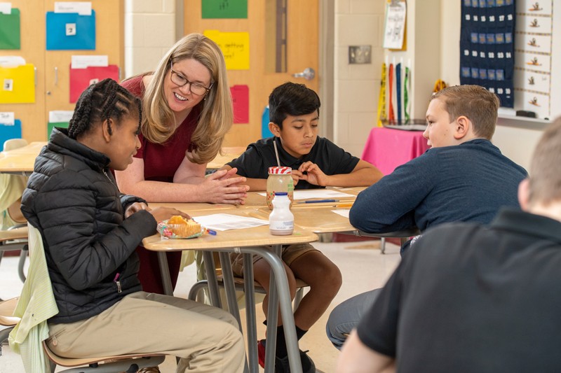 University of Delaware School of Education Professor Amanda Jansen speaks with students at Milford Central Academy