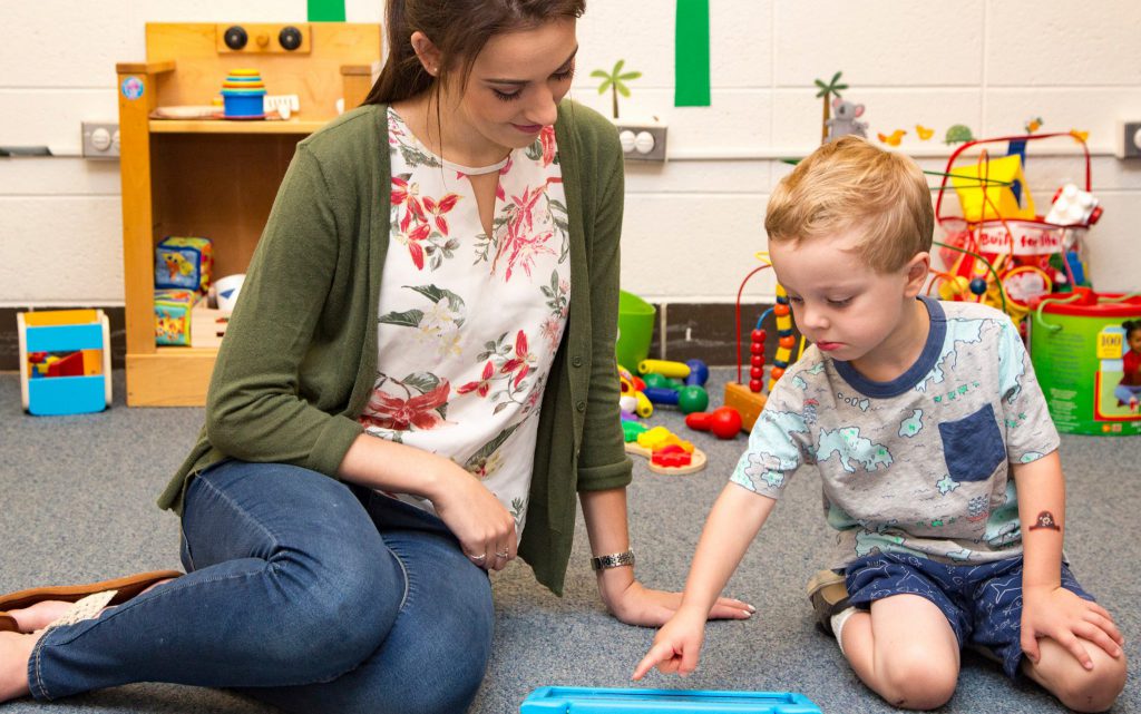 Hillary May studies a toddler at the Child’s Play, Learning, and Development Lab