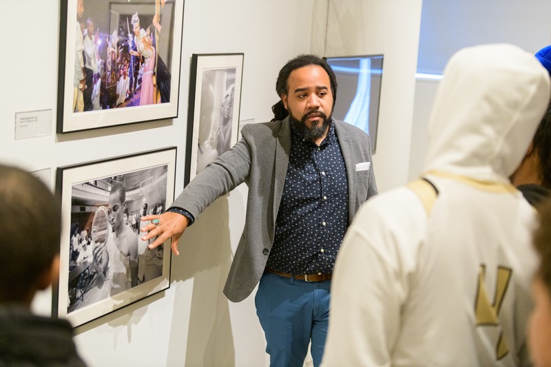 UD Prof. Roderick Carey speaks to a group of black and Latino boys at the Delaware Art Museum