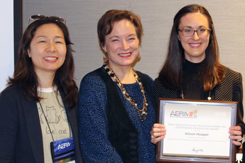 Myae Han and Martha Buell with alum Alison Hooper at AERA