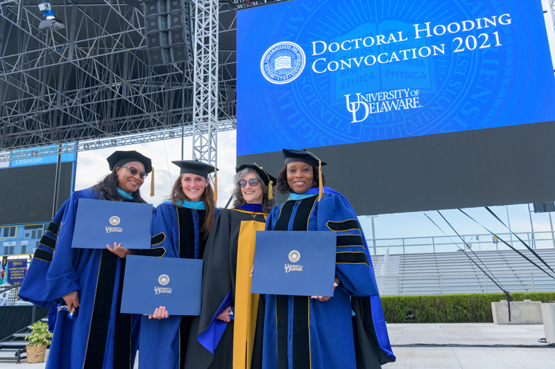 Hooding ceremony for 2020 and 2021 Doctoral Candidates, held on May 27th, 2021 in Delaware Stadium under the direction of UD President Dennis Assanis and Lou Rossi, Dean of the Graduate College and Vice Provost for Graduate and Professional Education.