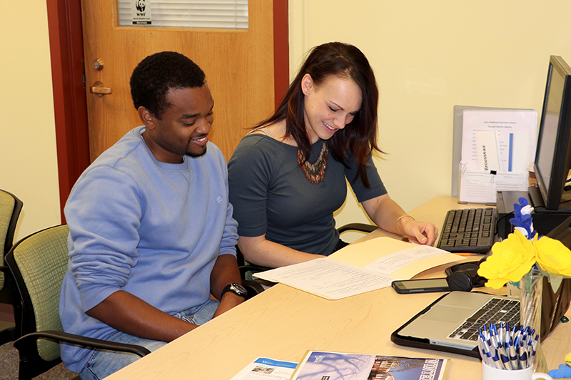 Two students reading at a desk