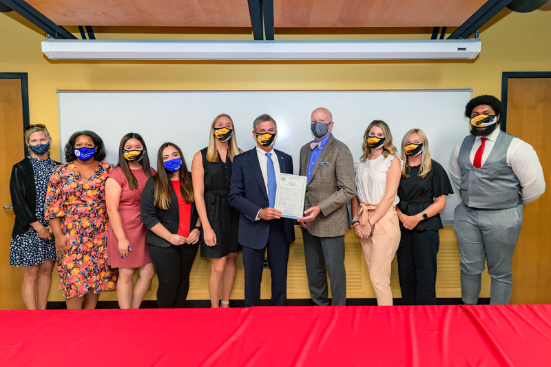 From left to right: Krissy Najera (director of DCTE), Jamie Bailey (director of UD’s Teacher Residency program), Mariela Lomeli, Alexa Cruz, Meghan Purcell (UD residents), Governor John Carney, CEHD dean Gary T. Henry, Meghan Salter, Claire Bennett, and Clark Scott (UD residents)