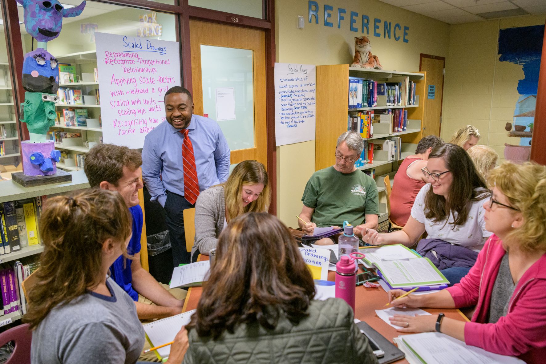 Staff from UD’s Professional Development Center for Educators (PDCE) engage in a professional development session with math teachers from several schools at Talley Middle School in Wilmington, Delaware.