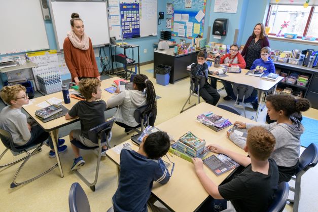 Student teacher leading a class of elementary school level students