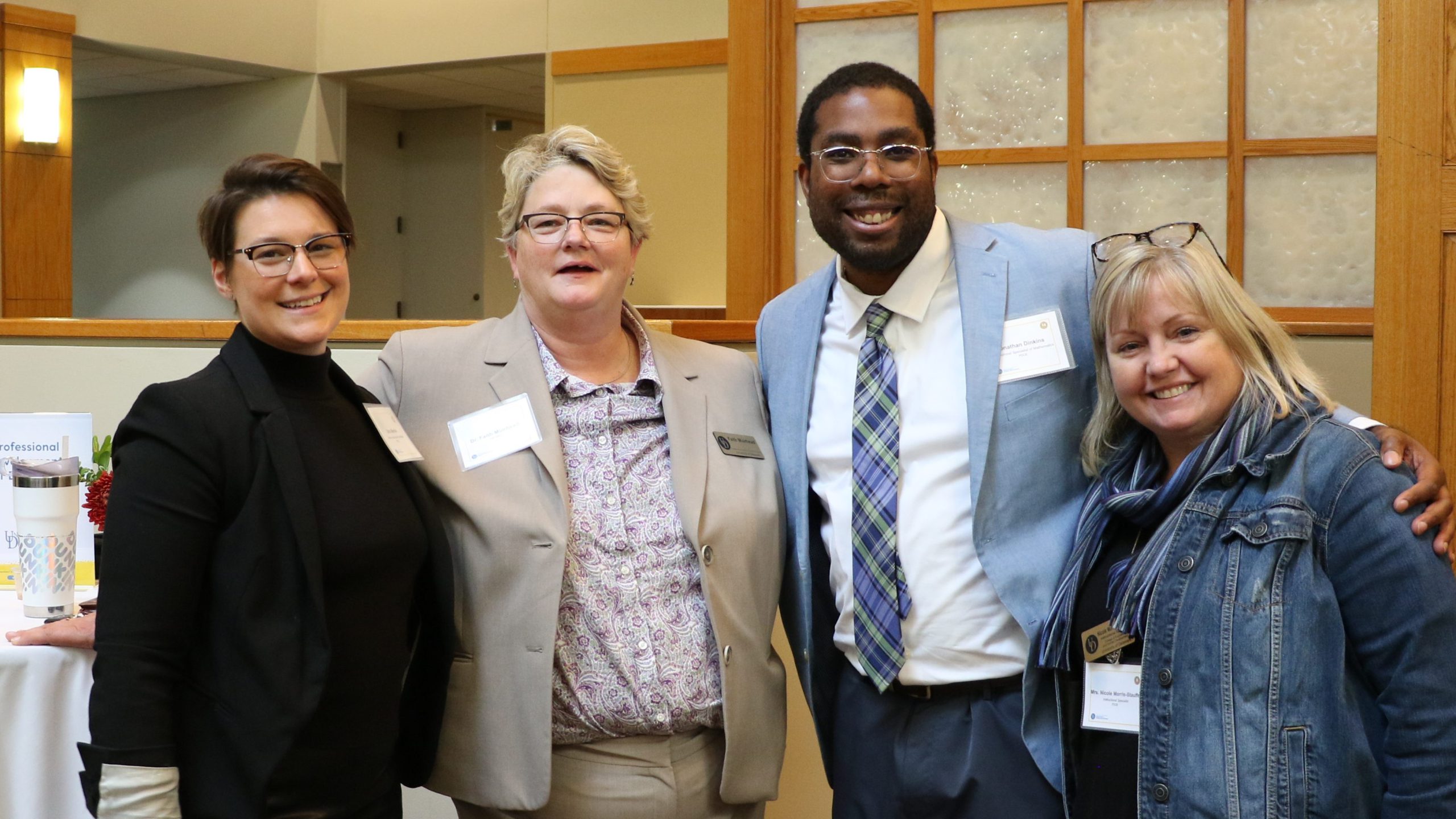 Faith Muirhead with attendees at the University of Delaware School Success Center launch event.