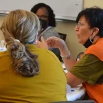 Lynne Portlock, a family child care educator from New Castle County, talks about managing children’s behavior at a professional learning session.