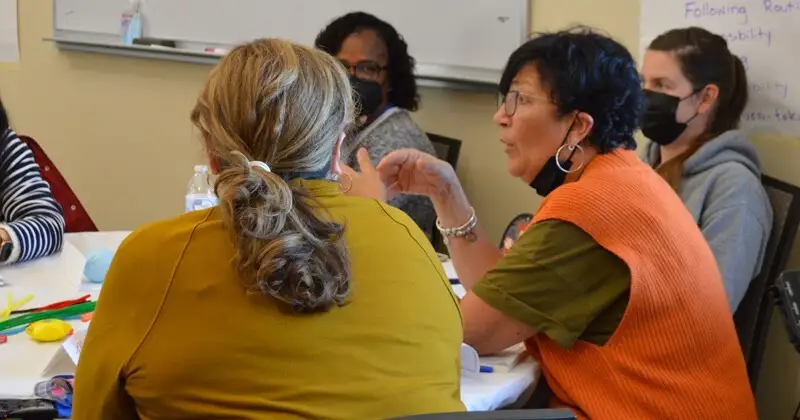 Lynne Portlock, a family child care educator from New Castle County, talks about managing children’s behavior at a professional learning session.