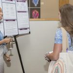 A CEHD student shares research with others at the 2022 Steele Symposium.