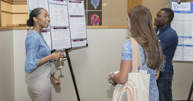 A CEHD student shares research with others at the 2022 Steele Symposium.