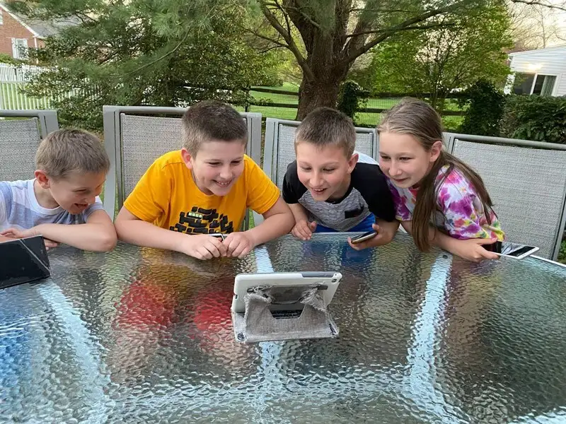 The Skrypniuk children from Ukraine enjoy one of the interactive e-books on Stories with Clever Hedgehog.