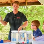 UD 2023 graduate Brenden Swanik (center) explains to pre-K students from UD’s Early Learning Center how to do their own “CubeLab” experiments. Swanik, along with fellow alumni Andrew Marino and Nick Ulizio, translated their senior design project into an outreach activity.