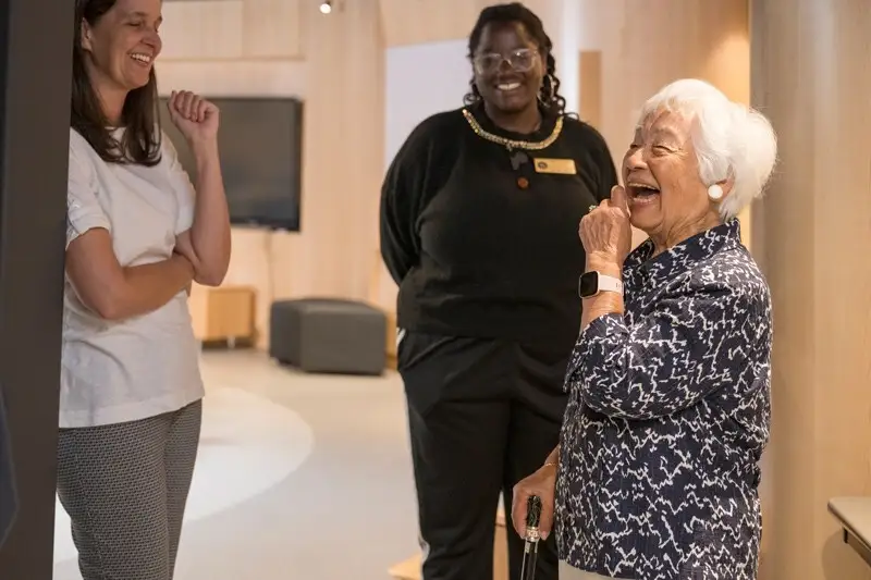 A joyful Hong tours UD’s Center for Intercultural Engagement alongside student associate Dulcine Stephens (center) and assistant vice president for student life philanthropy Stacey Muzzi (left).