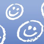 blue background with white smiley faces