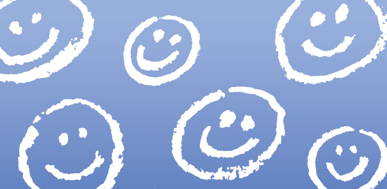 blue background with white smiley faces