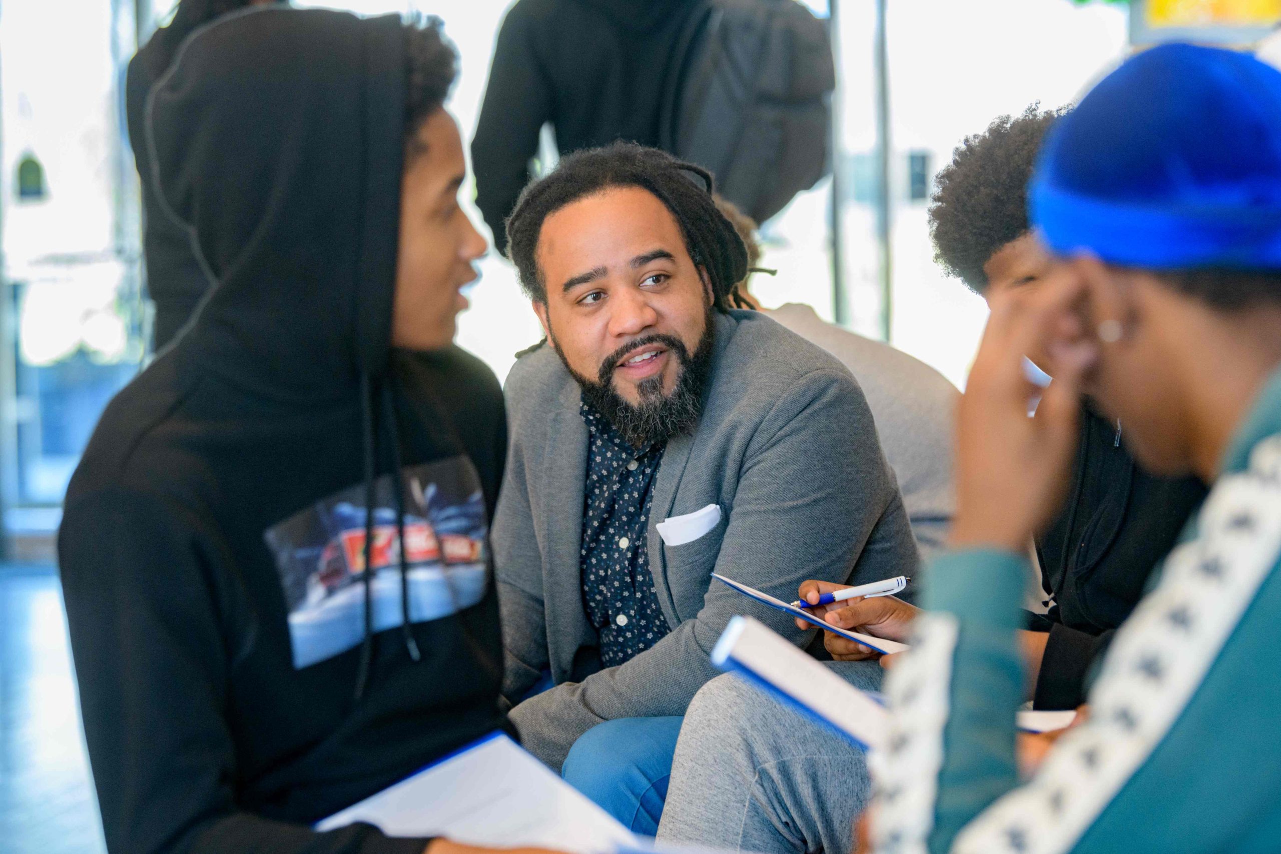 Roderick Carey speaking with high school students.