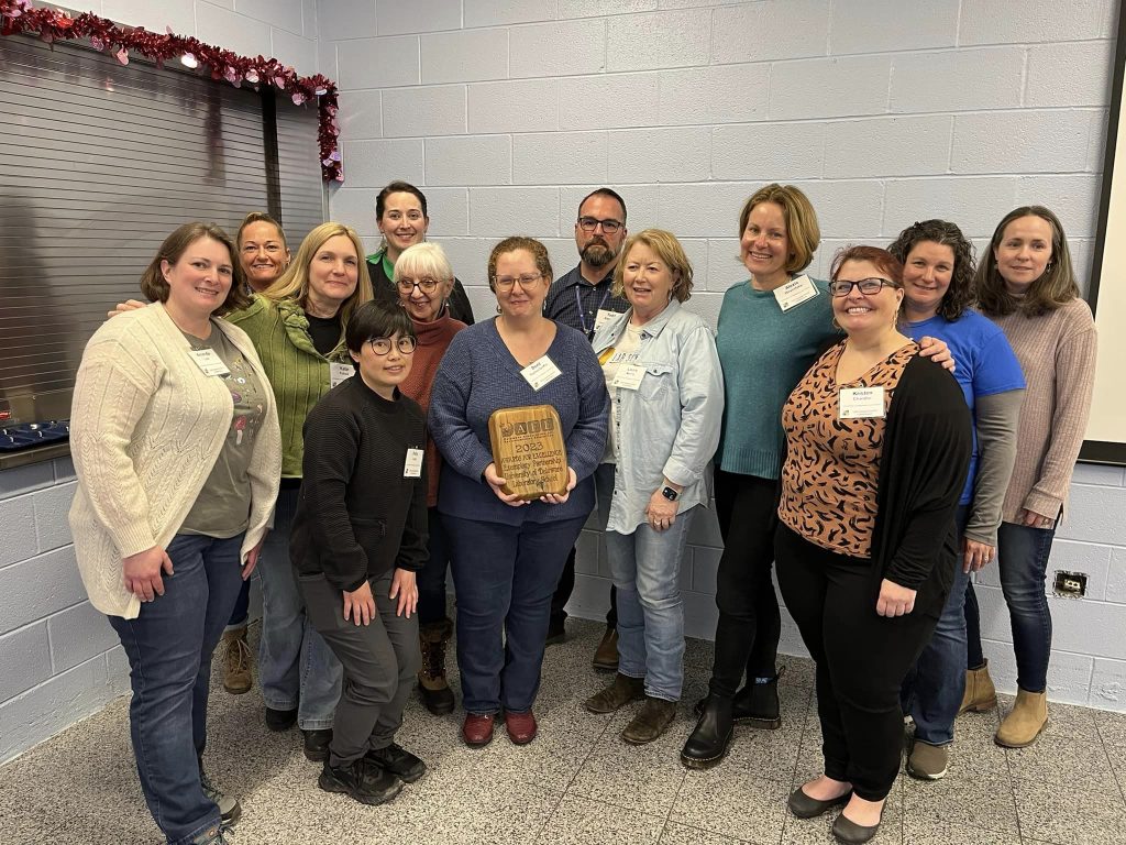 The Lab School staff receives their award from board members of the Delaware Association for Environmental Education (DAEE) at the DAEE annual conference on Feb. 24, 2024.