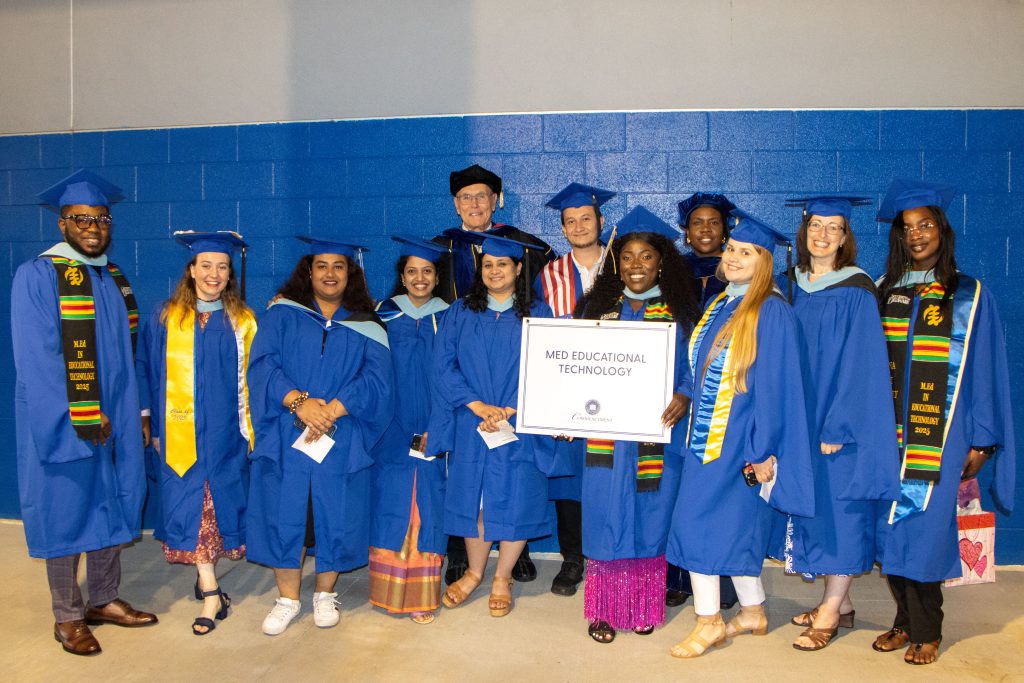 School of Education Professor Fred Hofstetter (back center) with the graduates of the M.Ed. in educational technology program.