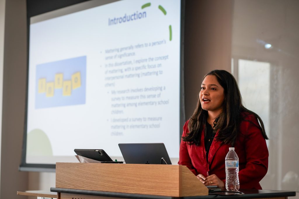 Polanco presents the results of her doctoral work at her dissertation defense.