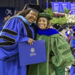 The University of Delaware’s May 2025 Doctoral Hooding Ceremony honored about 230 students, including Sophia Vilceus (left), who was hooded by Kisha Porcher.
