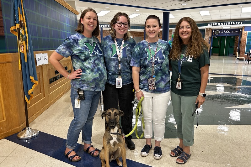 Lauren Dombrowski (second from left) with McKean High School school psychologists Missy Weyl, Elizabeth Mikolajczyk and Jessica Kradjel on the first day of the 2025-2026 school year. They also stand with a golden retriever.