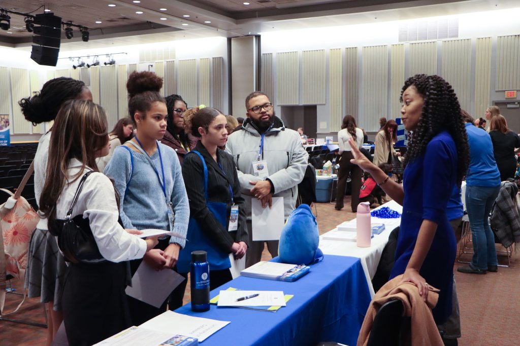 Teresa Hickok, CEHD director of associate programs, talks with students at the Educator’s Rising recruitment fair. UD offers flexible associate degrees in early childhood education and elementary and middle school teacher education. 