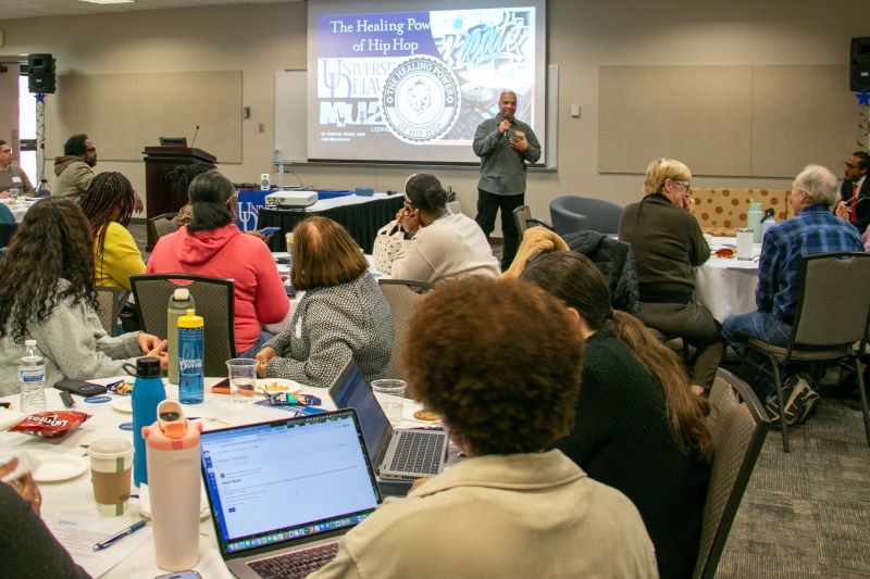 Raphael Travis, CEHD professor and director of the MSW program, presents his work on the healing power of Hip Hop music at the “Global Voices in Community Wellness and Youth Violence Prevention” in March 2026.