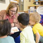 Rena Hallam, interim dean of the College of Education and Human Development (CEHD) and professor in its Department of Human Development and Family Sciences, plays with children at CEHD’s Early Learning Center.
