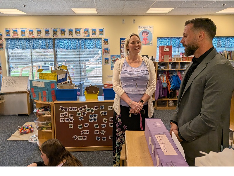 Michael Saylor visits a classroom in CEHD’s Early Learning Center and talks with Jessica Peace, one of the center’s co-directors.