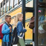 Children board a school bus.