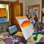 Students with disabilities often use adaptive devices to support their artistic work. Here, an ArtFest participant uses an adaptive tool during an ArtFest event. During the Center for Disabilities Studies’ training, visual and performing arts teachers learned how to support students with tools like this one and in other ways.